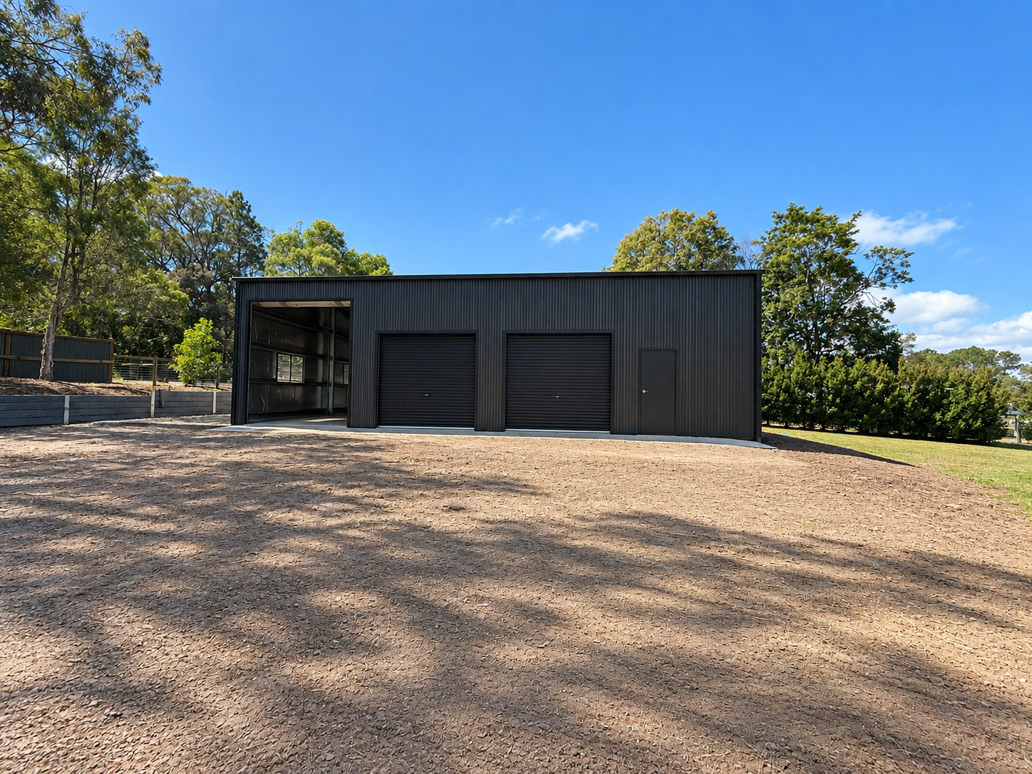 Front view of a completed steel shed built by a licensed shed builder