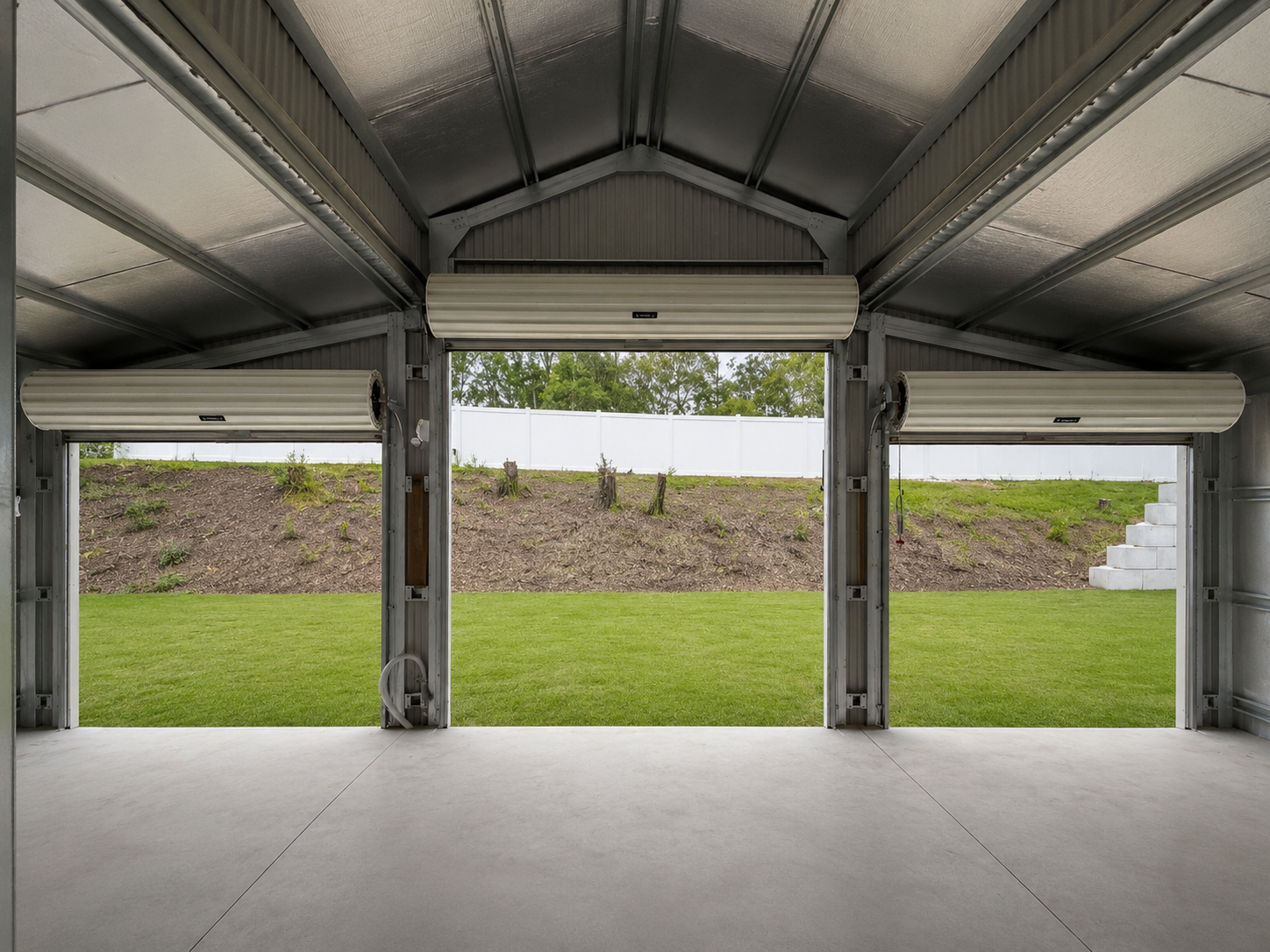 Interior of a 12m x 9m residential shed showing clearance and storage space, Canungra